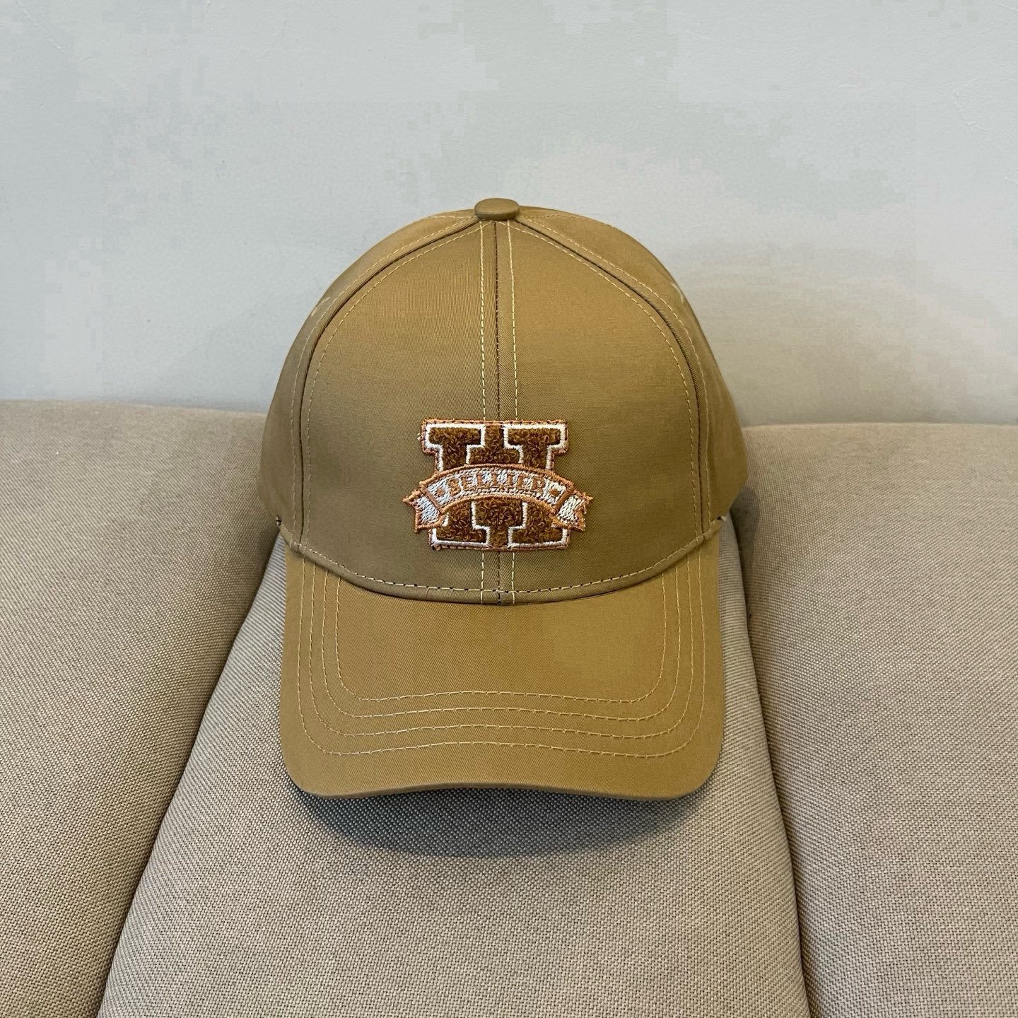 HERMÈS Khaki Embroidered “H” Baseball Cap in Heritage Varsity Style