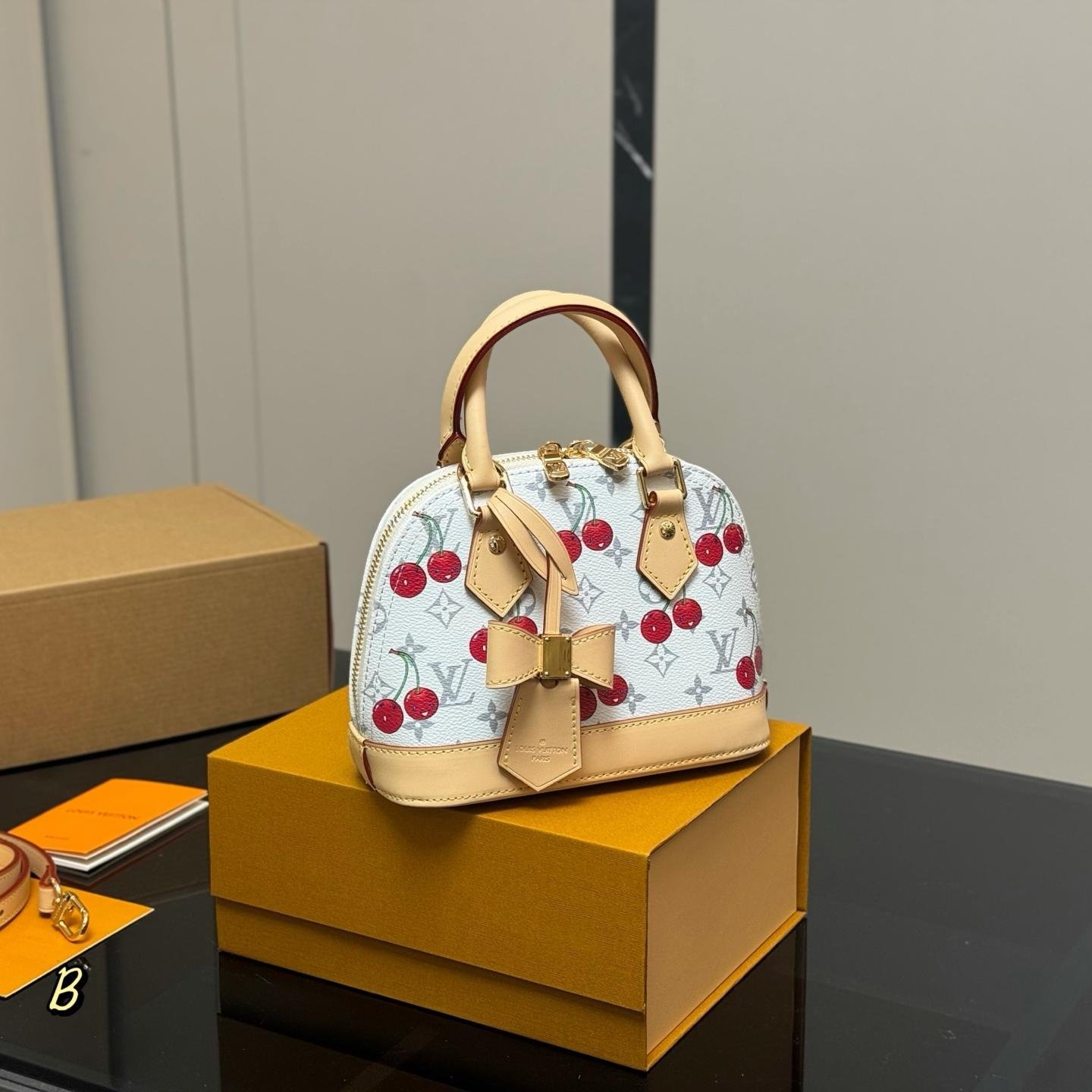 LV Alma Cherry Monogram Leather Handbag – 25cm Shell Bag